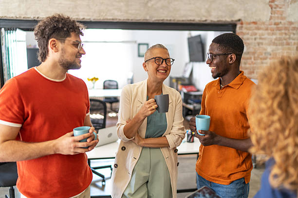 istock Diverse business team partners enjoying coffee break and laughing 2240779899