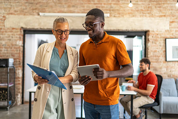 istock Diverse business colleagues collaborating on project in modern office 2240780687