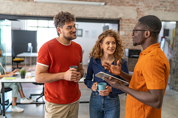 istock Diverse coworkers collaborating during coffee break in office 2240781171