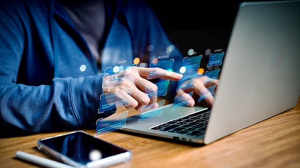 istock Businesswoman using laptop with digital workflow management interface, project timeline, and task automation dashboard for agile productivity, business technology, and data-driven efficiency. 2240782115