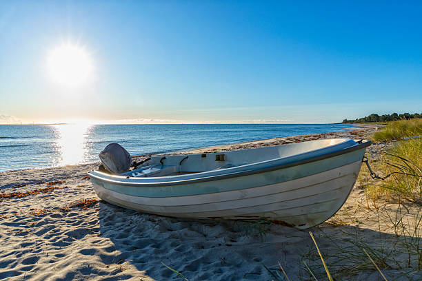 istock Small boat on the beach of Saksild Strand, Denmark 2240782599