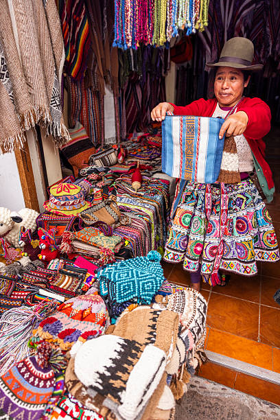 istock Peruvian woman spinning a wool in Pisac, Urubamba Valley 2240784900