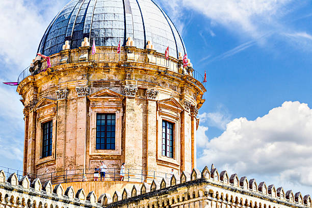 Palermo, Italy, Sicily; July 18, 2025: Tourists strolling outside Palermo Cathedral, a Byzantine basilica