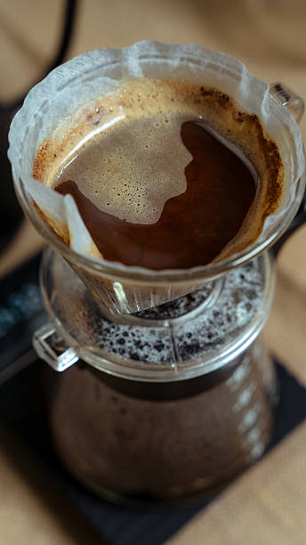 istock Brewing fresh pour-over coffee in a glass filter brewer 2240793578