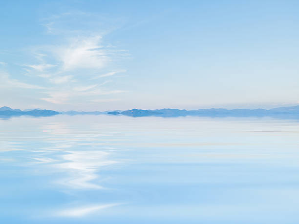 Clear blue sea waves. Sea surface as seen from the water surface level. Abstract background pattern.