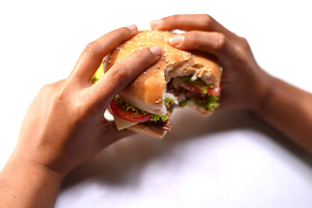 istock Food Lovers Eating hamburger on white background. 2240795370
