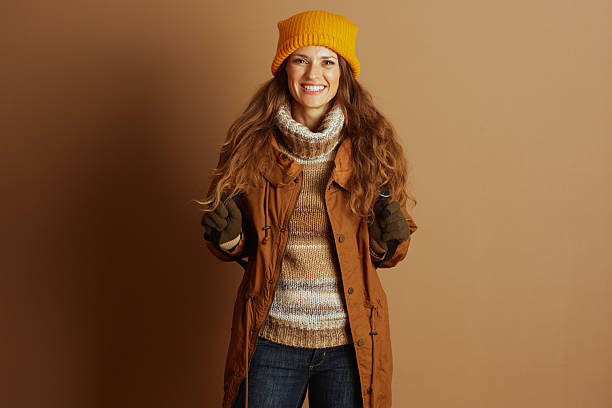 istock Joyful Hiker in Winter Attire with Ski Poles 2240797070