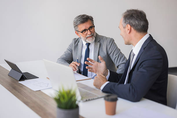 istock Businessmen discussing strategy during a corporate meeting in office 2240797206