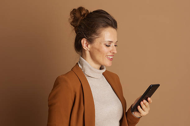 istock Focused Woman Browsing on Smartphone 2240800656