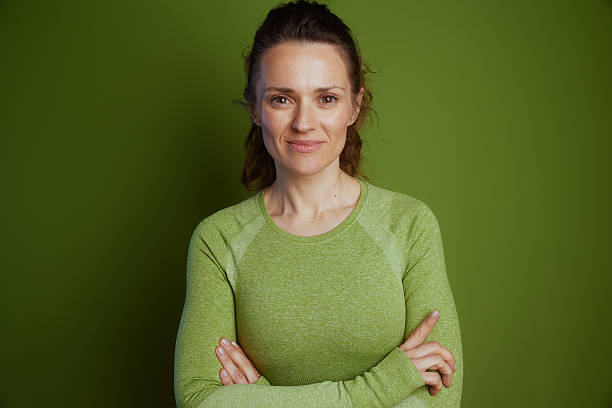 istock Confident, relaxed woman in green 2240801241