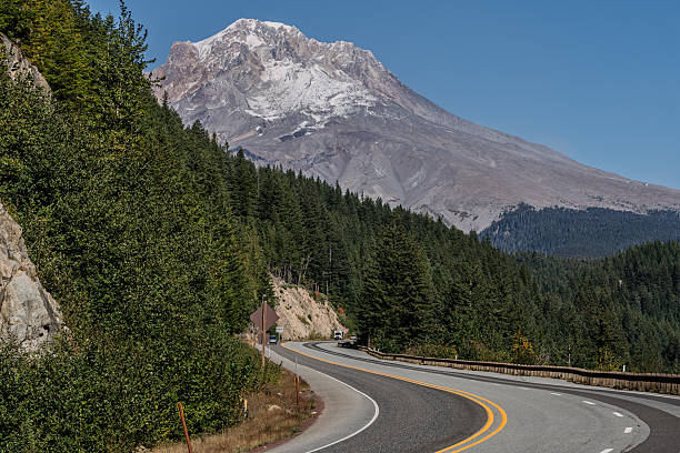 A scenic drive through the Mount Hood National Forest on the way up the mountain on an autumn day with Mount Hood in the background