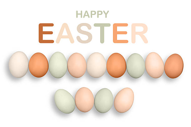 Chicken eggs on the white background with word HAPPY EASTER. Eggs are one of the most nutritious and versatile foods in the world.