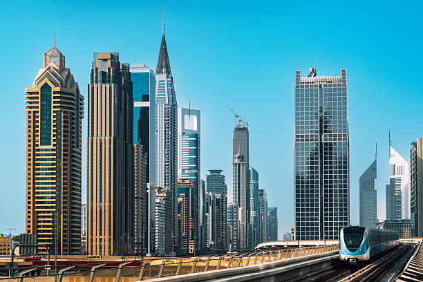istock Dubai Skyline and Metro Train on Sheikh Zayed Road With Modern Skyscrapers 2240806623