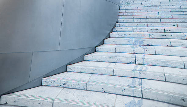 istock A curved marble staircase against an gray metal wall 2240806745