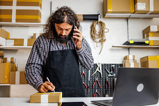 istock Small Business Owner Managing Online Sales from Store 2240807843