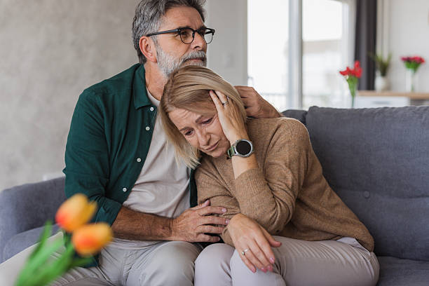 istock Senior man comforting sad woman in difficult moment 2240811493