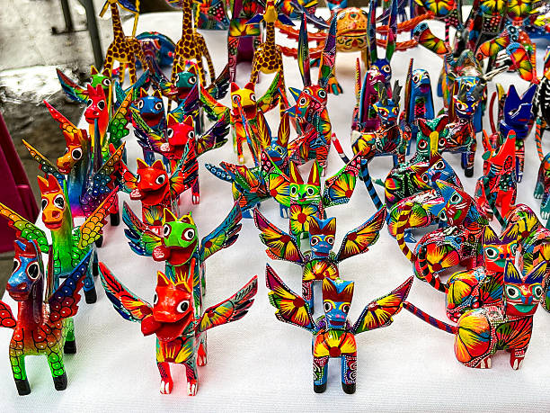 Colorful Mexican Alebrijes Handcrafted Figurines on White Background
