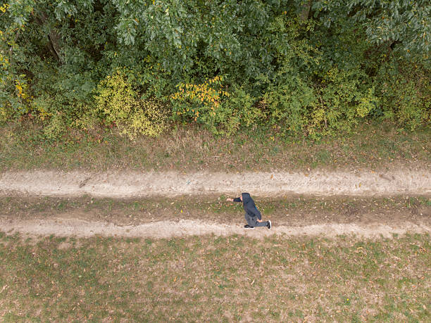 istock Jogging in countryside man 2240813252