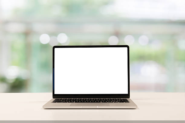 istock close up blank white screen display of laptop computer on table in office building with garden scene for add content of design banner,website or template or online shopping e-commerce concept 2240814320
