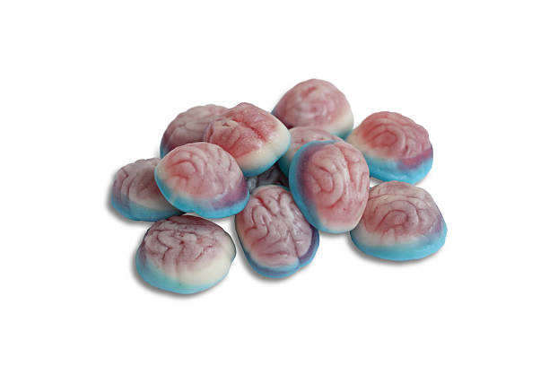Colorful Halloween candies shaped like brains on a white background