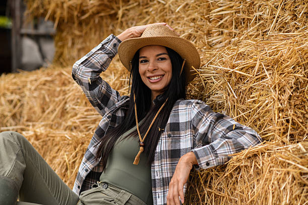 istock Happy Farmer Woman Posing on Hay 2240823891