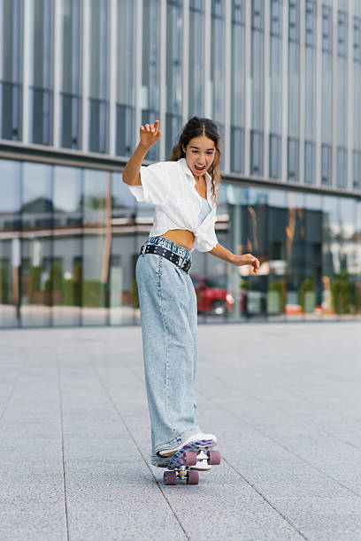 istock Girl Balancing On Skateboard 2240824338