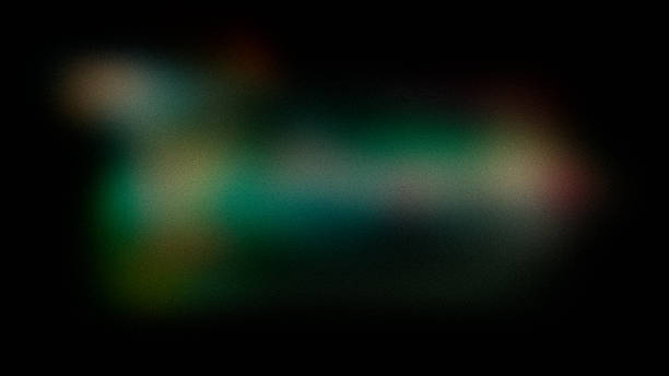 istock Abstract grainy blurred background with green, pink, and light spots in a black frame. 2240826315