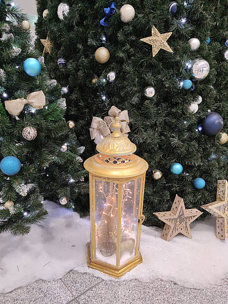istock decorated Christmas tree and festive decorative lantern close-up 2240826405