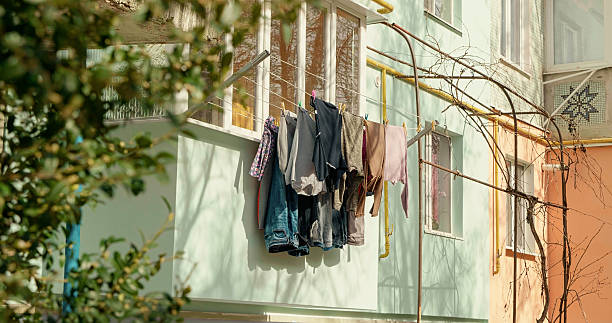istock Typical soviet union block panel residential buildings exterior facade with clothes hang ouside. 2240828557