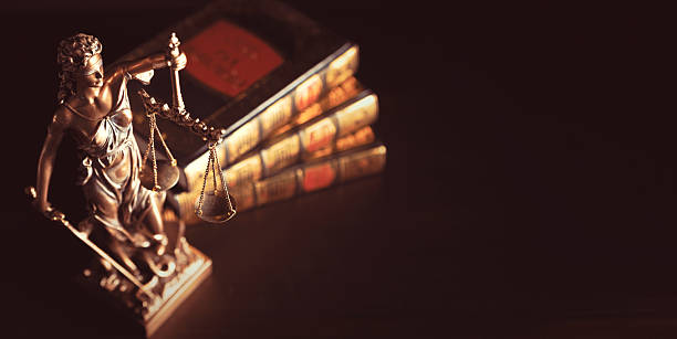 istock Lady justice. Statue of Justice in library 2240832512