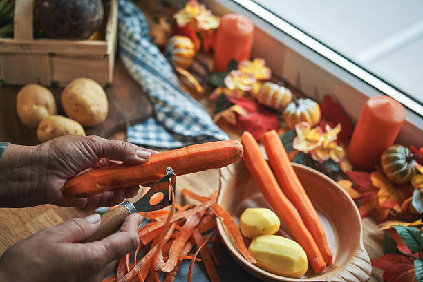 istock Cutting Vegetables for Stuffed Turkey Dinner in Domestic Kitchen 2240833288