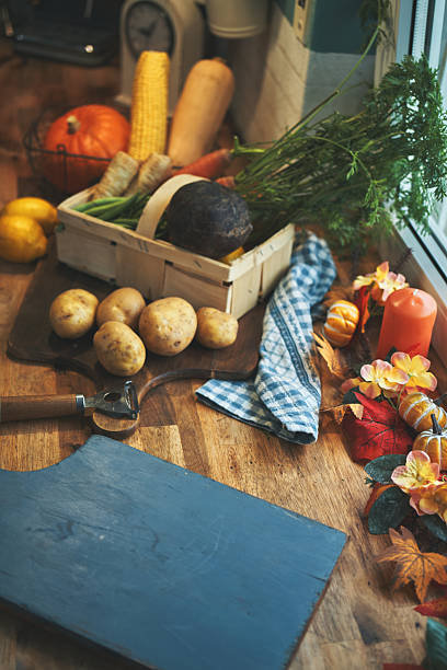 Cutting Vegetables for Stuffed Turkey Dinner in Domestic Kitchen