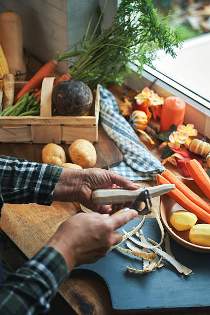 istock Cutting Vegetables for Stuffed Turkey Dinner in Domestic Kitchen 2240833334