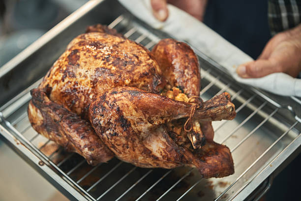 istock Roasting Turkey in the Oven for Holiday Dinner 2240833371