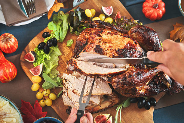 Having Stuffed Turkey for Thanksgiving Holiday Dinner with Vegetables and Gravy - Vertical Video Slow Motion