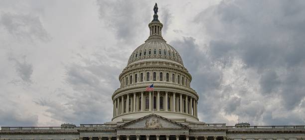 istock Panoramic view of US Capitol in Washington DC with cloudy sky background 2240837833