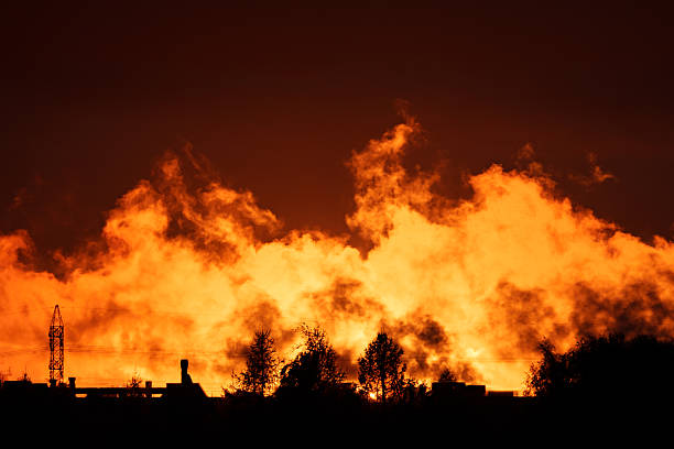 istock Dramatic fiery sunset sky over silhouetted landscape 2240840304