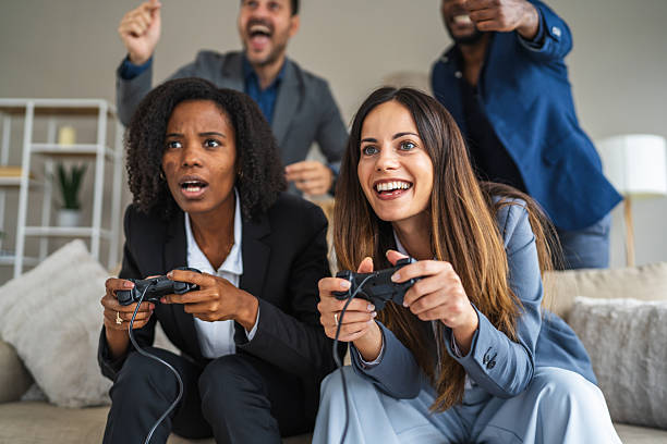 istock Businesswomen playing video games competing in office break 2240841692