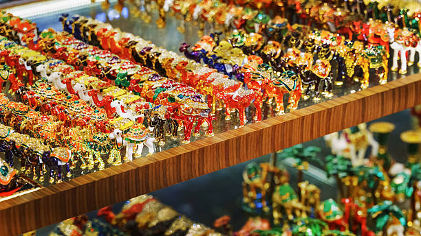 Many vibrant animal figurines are displayed in a Dubai store, attracting shoppers with their intricate designs.