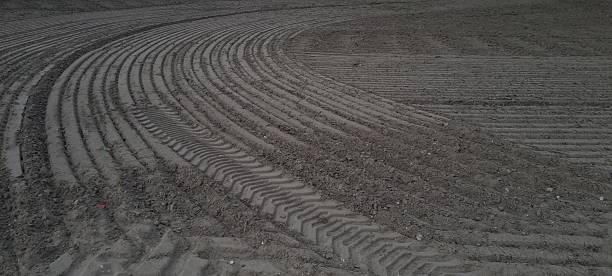 Agricultural Field Showing Tractor Tire Patterns after Plowing