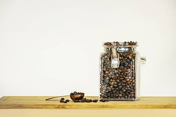 Three decorative jars filled with different coffee varieties, displayed with blank labels for customization.