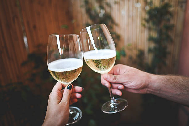 istock Couple toasting with wine celebrating special occasion 2240853046