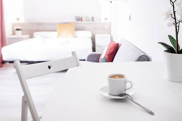 istock Cafe solo on a white wooden table and folding chair 2240855470