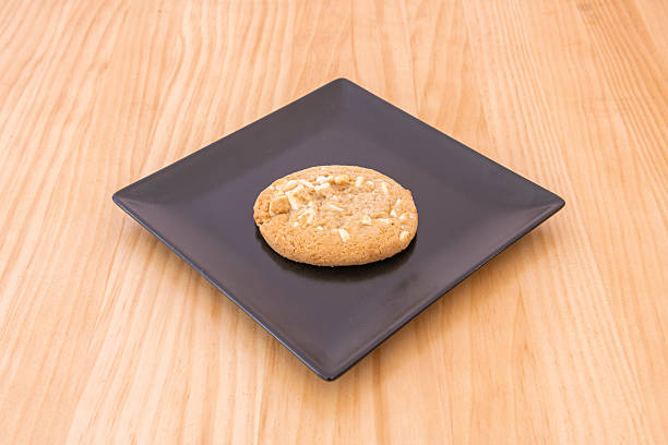 istock Cookie with white chocolate chips on wooden table 2240855627