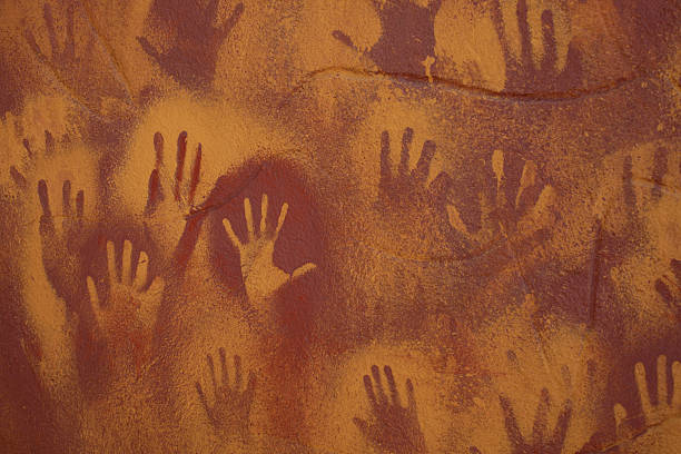 Dry earth, spinifex and gum trees in the Pilbara, Western Australia.