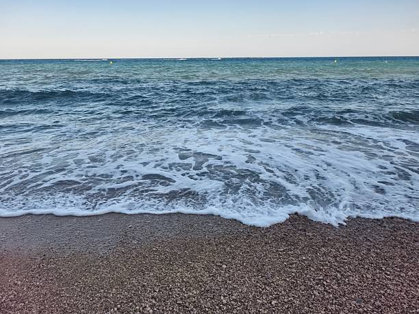 istock Serene Seaside Waves Gently Rolling In at Dawns Light, Creating a Peaceful Atmosphere 2240863258