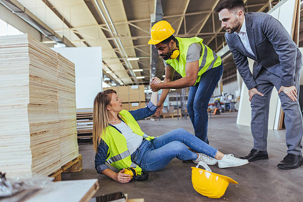 istock Workers Assisting Colleague After Accident in an Industrial Workplace Environment 2240865433