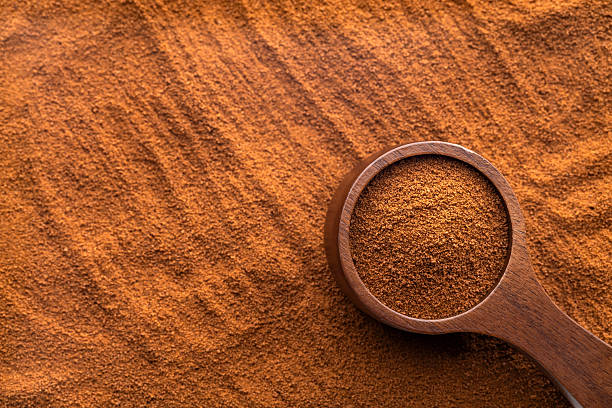 istock Dry instant ground coffee in a measuring spoon - Coffea 2240867732