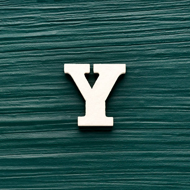 istock Capital letter Y, White letter on a rustic dark green background 2240867806