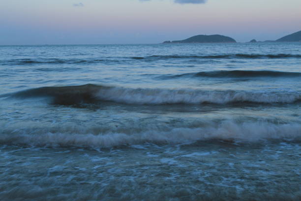 The sea water under the night sky has rich layers of colors